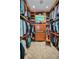Spacious walk-in closet with custom wood shelving and drawers, offering ample storage at 10808 Alico Pass, New Port Richey, FL 34655