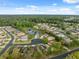 A nice aerial view of a neighborhood with a pond and nature preserve at 11254 Mollymawk Ct, New Port Richey, FL 34654