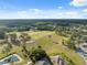 Scenic aerial view of the golf course highlighting lush fairways, tranquil ponds, and green surroundings at 11254 Mollymawk Ct, New Port Richey, FL 34654