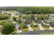 Aerial view of a neighborhood showcasing a tree-lined street and well-maintained single-Gathering homes at 11254 Mollymawk Ct, New Port Richey, FL 34654