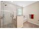 Bathroom featuring glass shower and separate tub at 11254 Mollymawk Ct, New Port Richey, FL 34654
