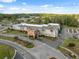 An aerial view of the community center with ample parking and landscaping in a suburban setting at 11254 Mollymawk Ct, New Port Richey, FL 34654