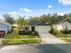 Beautiful home exterior with well-kept lawn and landscaping, offering great curb appeal and charm at 11254 Mollymawk Ct, New Port Richey, FL 34654