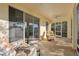 Comfortable screened patio area with sliding glass doors and seating area with two plush chairs at 11254 Mollymawk Ct, New Port Richey, FL 34654