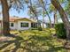 Spacious backyard featuring mature trees and lush greenery at 11536 Golden Rain Dr, New Port Richey, FL 34654
