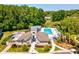 Exterior of the community clubhouse with an inviting pool area at 11536 Golden Rain Dr, New Port Richey, FL 34654
