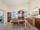 Traditional dining room with chandelier and furnishings for entertaining at 11536 Golden Rain Dr, New Port Richey, FL 34654