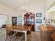 Traditional dining room features a wooden table, cabinet, and decor at 11536 Golden Rain Dr, New Port Richey, FL 34654