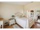 Cozy main bedroom featuring bright walls, wood-look floors, and stylish nightstand decor at 11536 Golden Rain Dr, New Port Richey, FL 34654