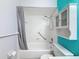 Bathroom features a shower and tub combination, a vanity, a medicine cabinet and an accent wall at 11648 Boynton Ln # 39Gb, New Port Richey, FL 34654