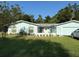 Charming single-story home featuring a well-manicured lawn and attached garage at 11648 Boynton Ln # 39Gb, New Port Richey, FL 34654