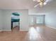 Living space showcasing tile flooring and an archway leading to the kitchen at 11648 Boynton Ln # 39Gb, New Port Richey, FL 34654