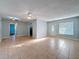 Bright and airy living room with neutral colors, tile flooring, and ample natural light at 11648 Boynton Ln # 39Gb, New Port Richey, FL 34654