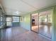 Enclosed porch with tile floor and view of the backyard through sliding glass doors at 11648 Boynton Ln # 39Gb, New Port Richey, FL 34654