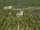 Aerial view of a beautiful homesite set back from the road and surrounded by lush woodlands and natural beauty at 11730 Hawks Nest Trl, Brooksville, FL 34614