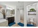 Well-lit bathroom featuring double vanities, a soaking tub, and a separate shower at 11730 Hawks Nest Trl, Brooksville, FL 34614