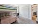Cozy bedroom featuring carpeted floors and closet at 11730 Hawks Nest Trl, Brooksville, FL 34614