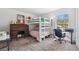 Bright bedroom space featuring bunk bed and desk at 11730 Hawks Nest Trl, Brooksville, FL 34614