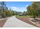 Long private driveway leads to a beautiful home nestled among mature trees on a large lot at 11730 Hawks Nest Trl, Brooksville, FL 34614