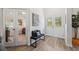 Inviting entryway with neutral paint, decorative bench and artwork, and tile floors at 11730 Hawks Nest Trl, Brooksville, FL 34614