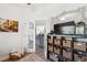 Open-concept design showcasing a living room with glass doors and stylish decor, creating a modern living space at 11730 Hawks Nest Trl, Brooksville, FL 34614