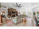 Bright and airy living room with fireplace and tile floors, and open to the dining room at 11730 Hawks Nest Trl, Brooksville, FL 34614