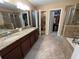 Spacious primary bathroom features a double vanity, walk-in closet, walk-in shower and a soaking tub at 11796 Crestridge Loop, New Port Richey, FL 34655