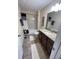 Standard bathroom with granite counters, shower-tub combo with curtain, and neutral decor at 11796 Crestridge Loop, New Port Richey, FL 34655