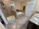 Well-lit bathroom with a shower, tub, and vanity at 11796 Crestridge Loop, New Port Richey, FL 34655