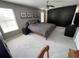 Large bedroom with a big closet, ceiling fan, and two windows with lots of light at 11796 Crestridge Loop, New Port Richey, FL 34655