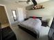 Cozy bedroom with carpet flooring, a ceiling fan, a closet, and neutral decor at 11796 Crestridge Loop, New Port Richey, FL 34655