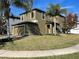 Attractive two-story home with a well-maintained lawn, attached garage and tidy landscaping at 11796 Crestridge Loop, New Port Richey, FL 34655