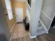 Bright foyer features neutral tones, tile flooring, and staircase to the second floor at 11796 Crestridge Loop, New Port Richey, FL 34655