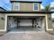 Spacious garage with high ceilings, providing ample room for vehicles and storage solutions at 11796 Crestridge Loop, New Port Richey, FL 34655