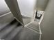Carpeted staircase leads to a living area with contemporary furniture at 11796 Crestridge Loop, New Port Richey, FL 34655