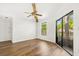 Bright room with neutral walls, wood floors, and natural light, creating a cozy atmosphere at 1208 Cypress Pond Rd, Palm Harbor, FL 34683