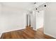 Spacious bedroom with wood floors, a ceiling fan, and closet access at 1208 Cypress Pond Rd, Palm Harbor, FL 34683