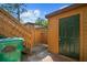 Exterior view of a door and staircase of a well-maintained home at 1208 Cypress Pond Rd, Palm Harbor, FL 34683