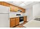 Bright kitchen featuring wooden cabinets and white countertops at 1208 Cypress Pond Rd, Palm Harbor, FL 34683