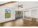 Spacious main bedroom featuring wood floors, ceiling fan, ample natural light, and closet space at 1208 Cypress Pond Rd, Palm Harbor, FL 34683