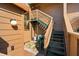 Exterior staircase with green trim leading to the upper level at 1208 Cypress Pond Rd, Palm Harbor, FL 34683