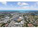 Expansive aerial view showcases the community near the ocean under a bright sky at 1216 Yawl Way, Venice, FL 34285