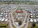 An aerial shot features the community pool, tennis courts, and meticulously maintained landscaping at 1216 Yawl Way, Venice, FL 34285