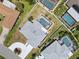 Aerial shot shows backyard pool, lush lawn, and a well-maintained home with neat landscaping at 1216 Yawl Way, Venice, FL 34285