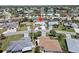 Aerial view of a home, showing the roof and large driveway in a residential neighborhood at 1216 Yawl Way, Venice, FL 34285