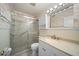 Cozy bathroom featuring a shower with glass door and vanity, offering a private and functional space at 1216 Yawl Way, Venice, FL 34285