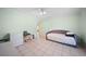 Functional bedroom space with tile floors, offering versatile use with plenty of open area at 1216 Yawl Way, Venice, FL 34285