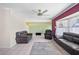 Spacious living room with neutral walls and tile flooring, great for entertaining at 1216 Yawl Way, Venice, FL 34285