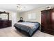 Comfortable main bedroom with ample space, natural light, and tile floors at 1216 Yawl Way, Venice, FL 34285