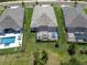 Aerial view featuring a spacious screened lanai for outdoor relaxation and entertainment at 12617 Wetmore Ct, Odessa, FL 33556
